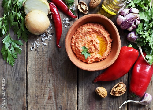 Paprika dip. Traditional middle eastern dip from roasted paprika, nuts, onion and garlic with fresh parsley. Copy space