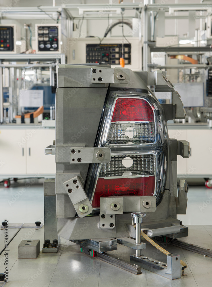 close-up factory equipment of quality control of automobile headlight. testing for compliance with the standard close-up factory equipment of quality control of automobile headlight. testing for compliance with the standard