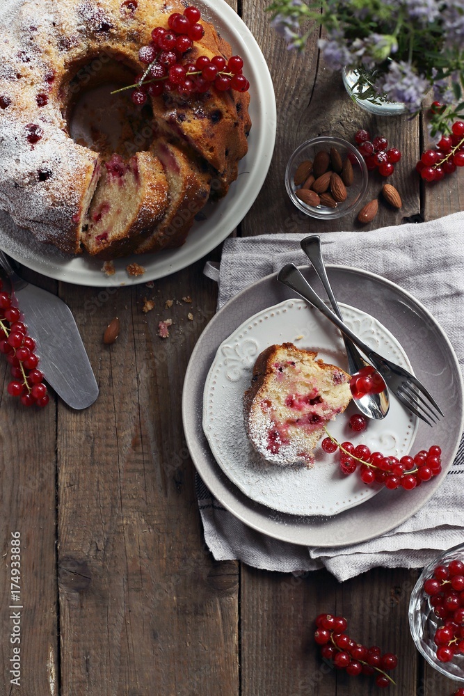 Bundt cake with fresh red currant. Overhead view. Rustic style Bundt cake with fresh red currant. Overhead view. Rustic style