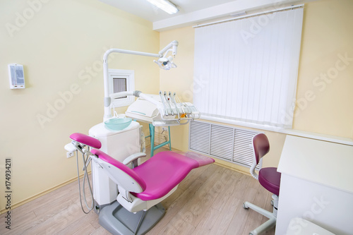 Modern dental office. Dental chair and other accessories used by dentists.