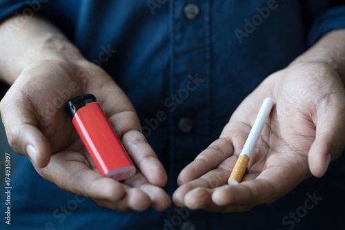 Male handle use lighters going to smoking a cigarette.