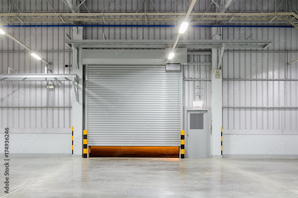 Roller door or roller shutter. Also called security door. Automatic  operation with electric motor. For protection home or building i.e.  factory, warehouse, hangar, workshop, shop, store and garage. Stock Photo |  Adobe