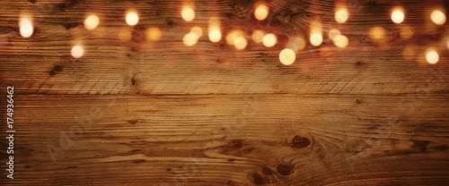 Wooden background with golden light effects