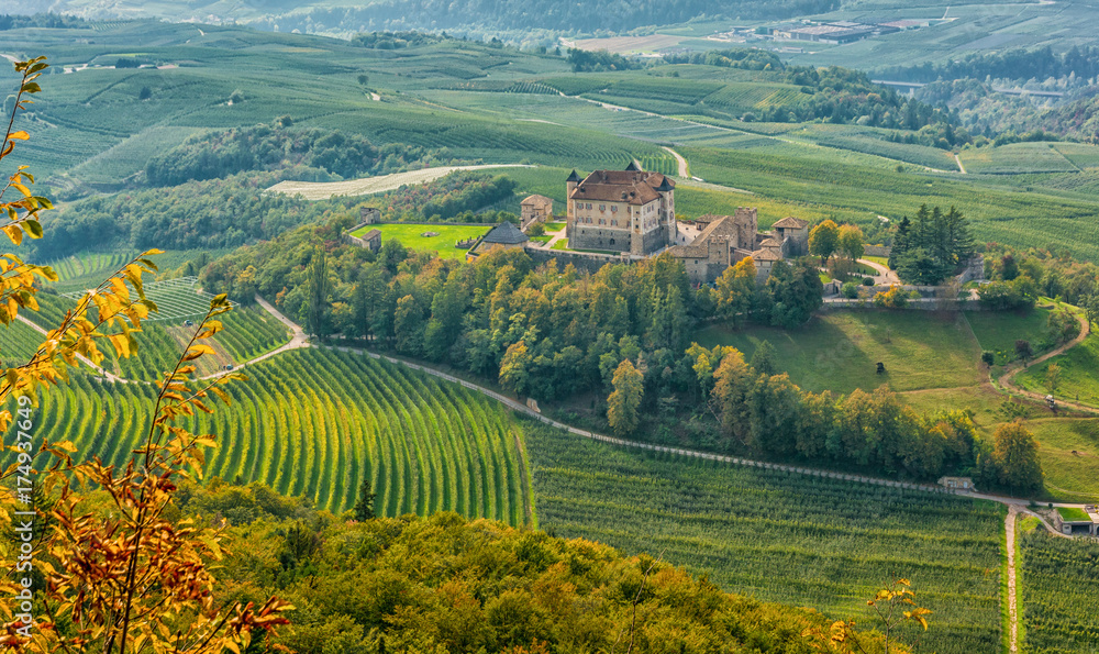 Naklejka premium autumnal landscape of Castel Thun, located in the commune of Ton in the lower Val di Non, Trentino Alto Adige, Italy