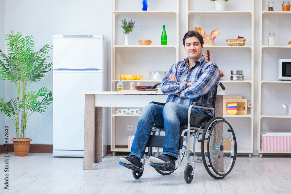 Disabled young man husband working in kitchen Disabled young man husband working in kitchen