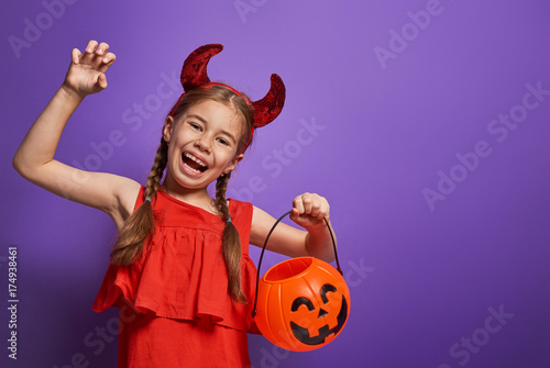 little devil with a pumpkin