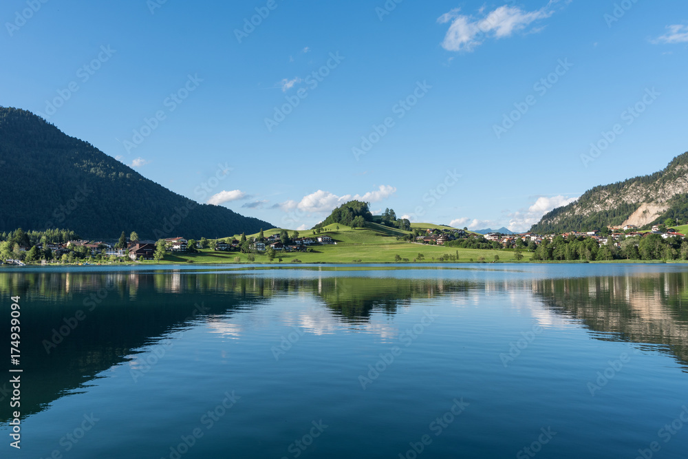 The mountain lake Thiersee in Tyrol, Austria The mountain lake Thiersee in Tyrol, Austria
