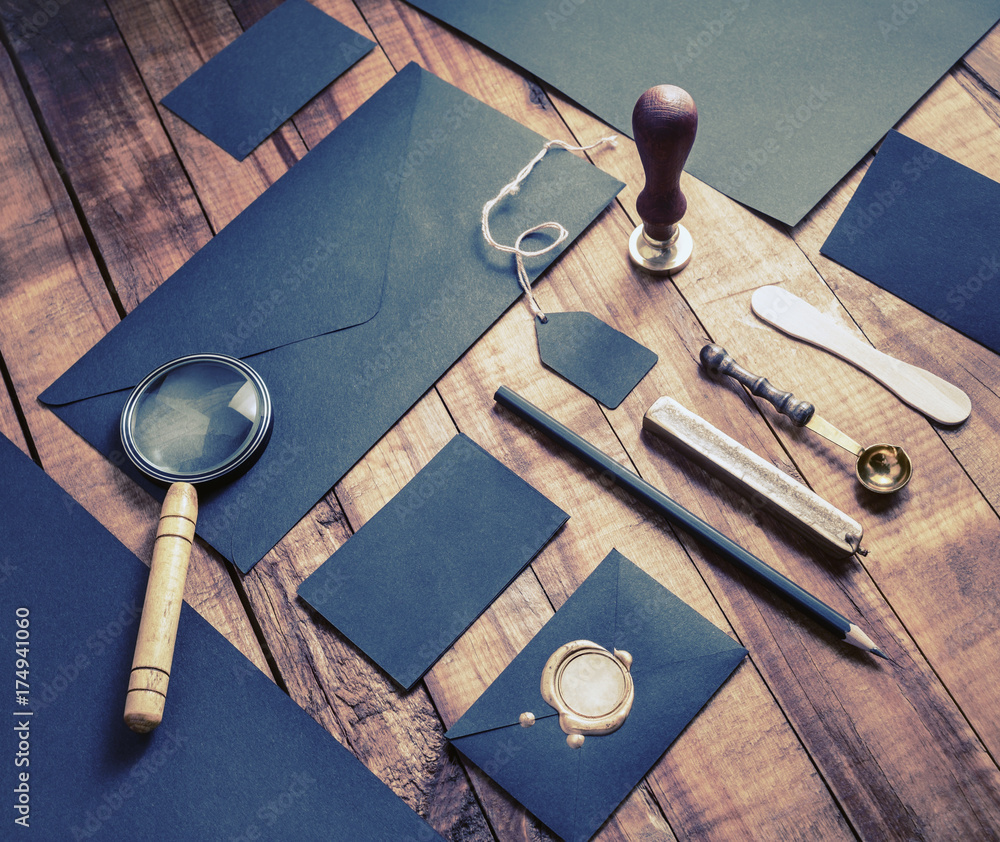 Photo of blank black corporate stationery elements on old wooden table background. Branding template. Mock-up for your design. Photo of blank black corporate stationery elements on old wooden table background. Branding template. Mock-up for your design.