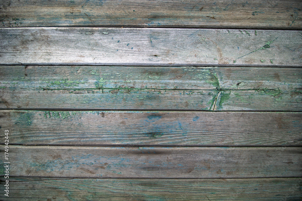 horizontal old weathered  wooden boards with green and blue traces of paint