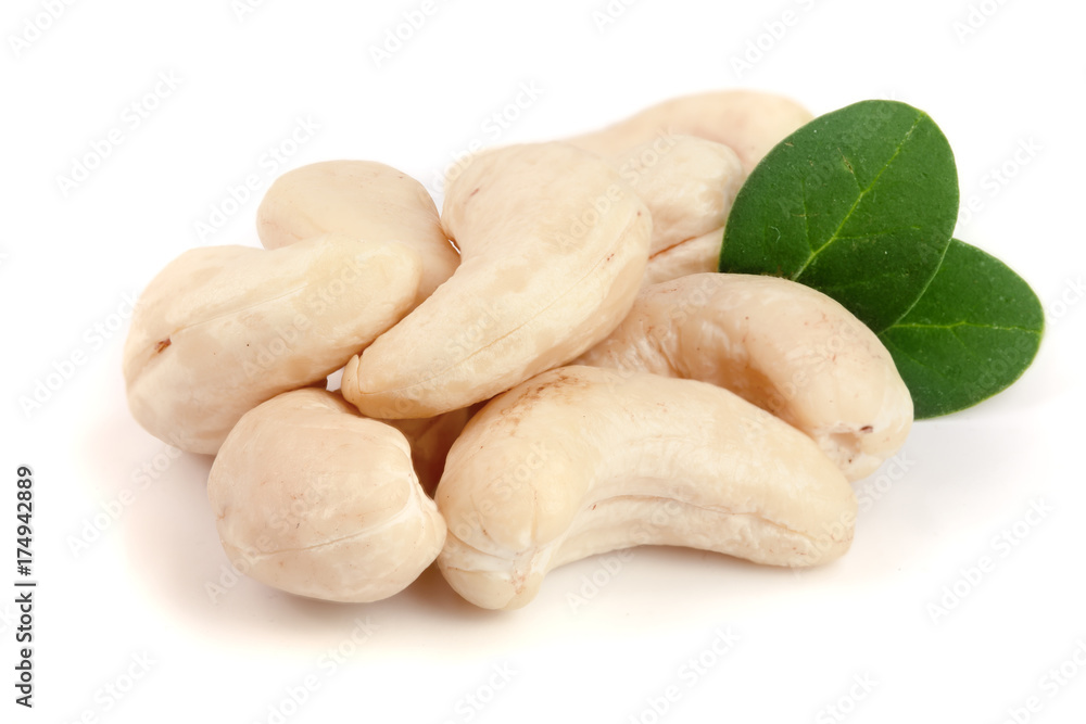 cashew nuts with leaf isolated on white background. macro cashew nuts with leaf isolated on white background. macro