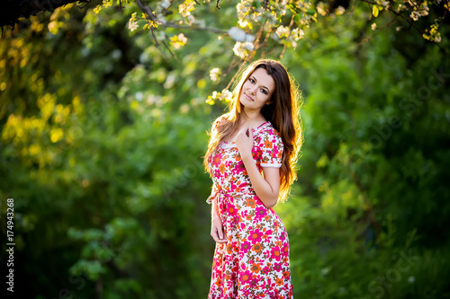 beautiful girl smiling in green park © zadorozhna