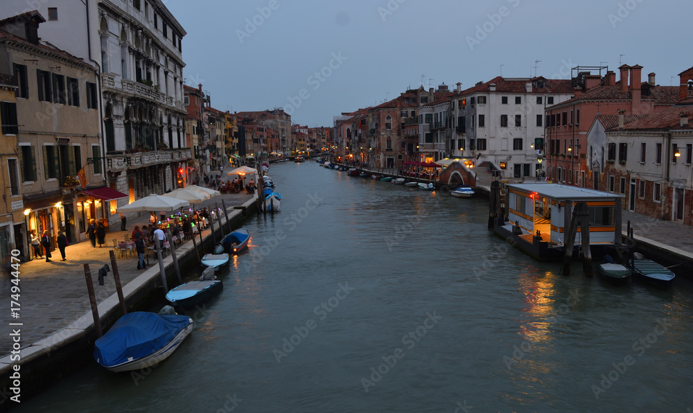  Cannaregio Canal Venice in the early evening with Restaurants, Bars and vaporetto stop.