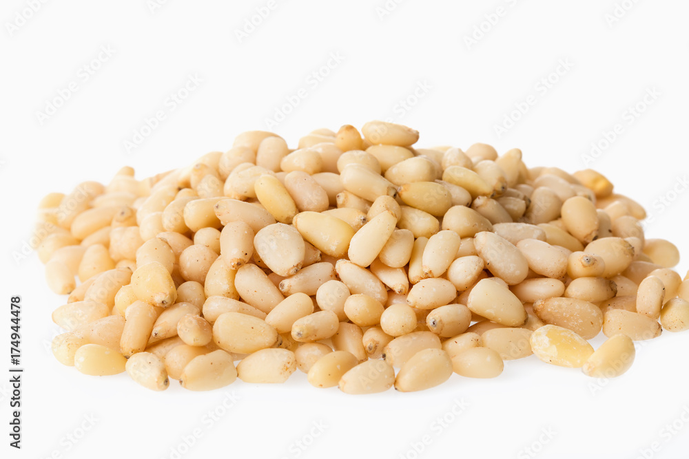 Cedar pine nuts isolated on white background. Cedar pine nuts isolated on white background.