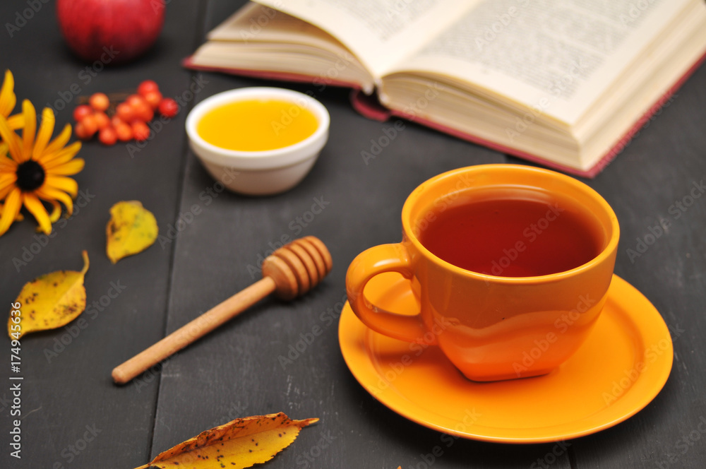 Autumn still life cup of tea, honey and book on the table Autumn still life cup of tea, honey and book on the table