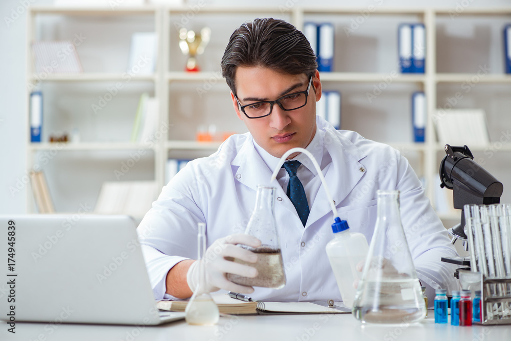 Young researcher scientist doing a water test contamination expe Young researcher scientist doing a water test contamination expe