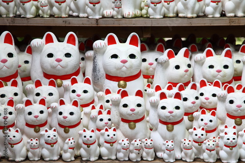 Tons of small dolls "the beckoning cat" known as maneki neko at Gotokuji in Tokyo, JAPAN.