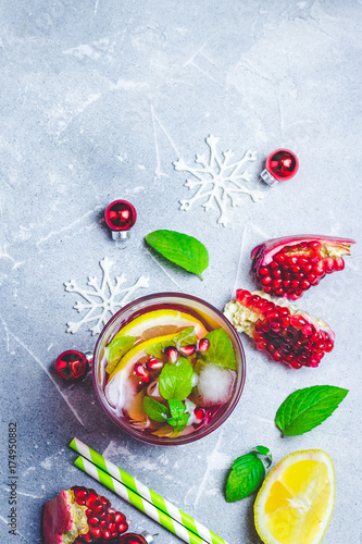 Festive alcohol pomegranate mojito. Top view, space for text.