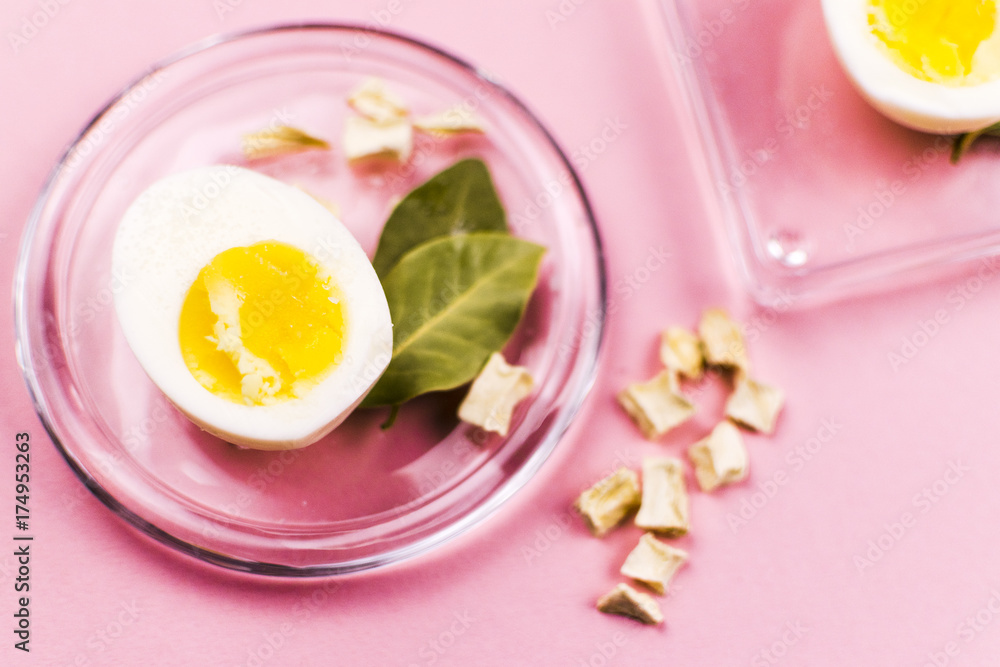 Boiled egg on a plate with vegetables and Bay leaf Boiled egg on a plate with vegetables and Bay leaf