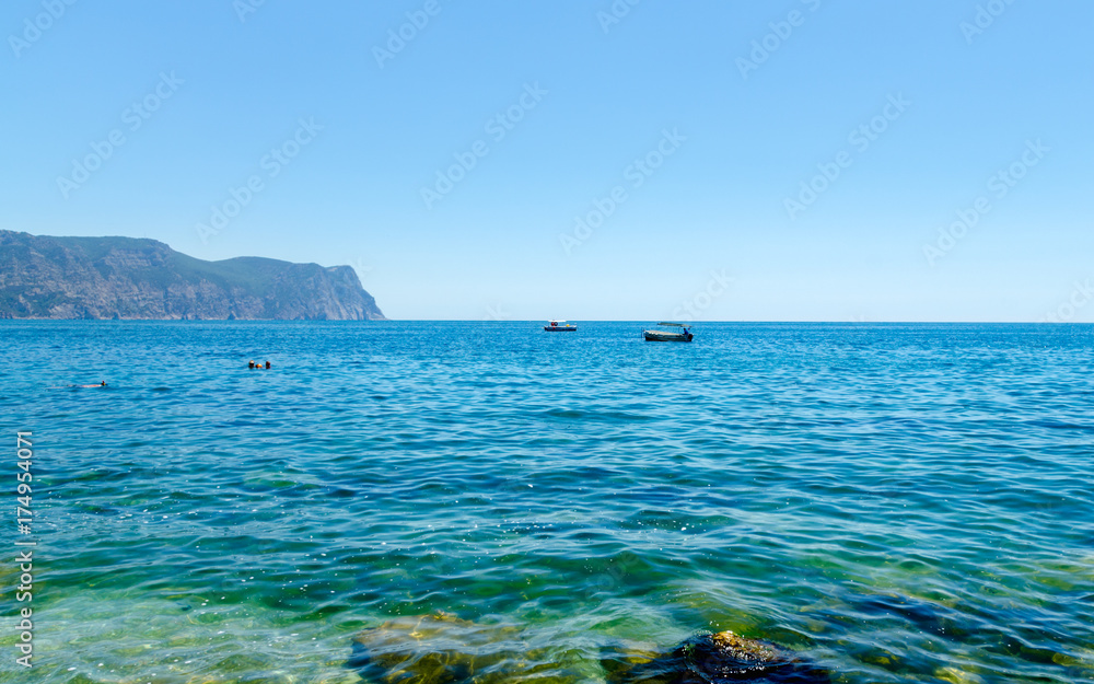 Fototapeta premium Panoramic beautiful azure sea summer landscape of Crimea shore with boat