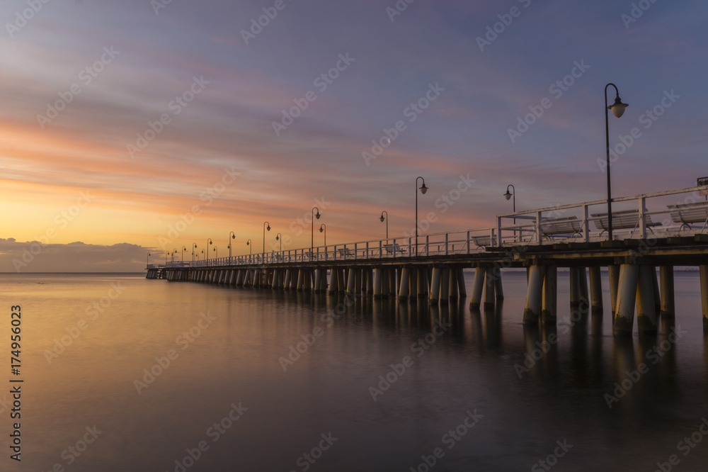 Beautiful sunrise over a wooden pier in Gdynia, Poland