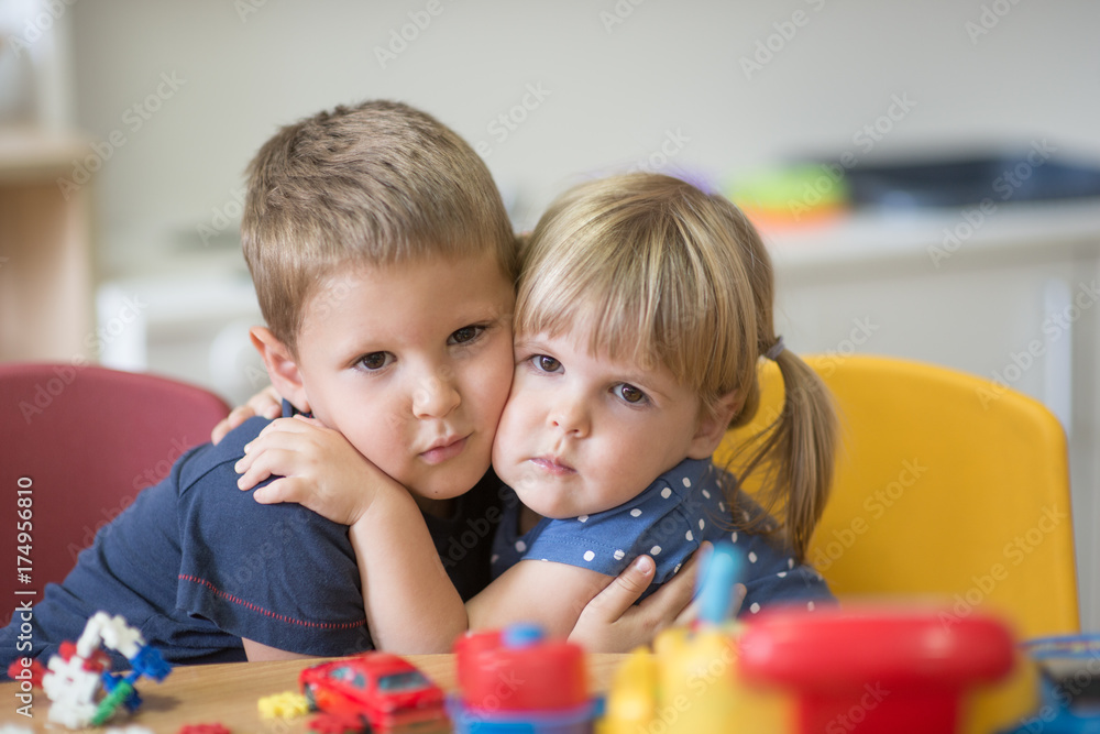 Fototapeta premium Hugged little caucasian kids