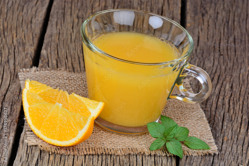 Orange juice in a glass on table Orange juice in a glass on table