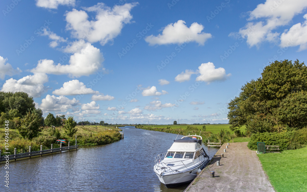 Fototapeta premium White yacht in the Reitdiep river in Groningen