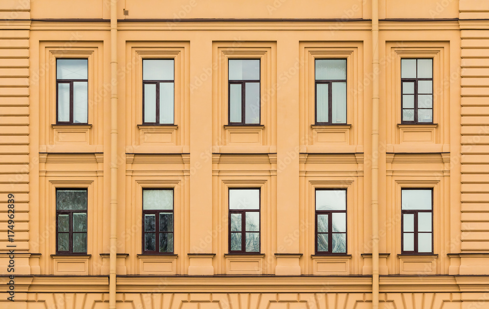 Many windows in a row on facade of urban office building front view, St. Petersburg, Russia