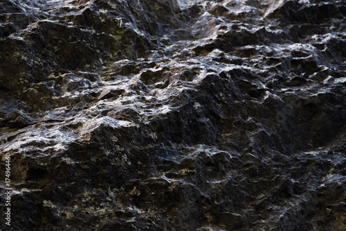 Dark rocky surface in low light