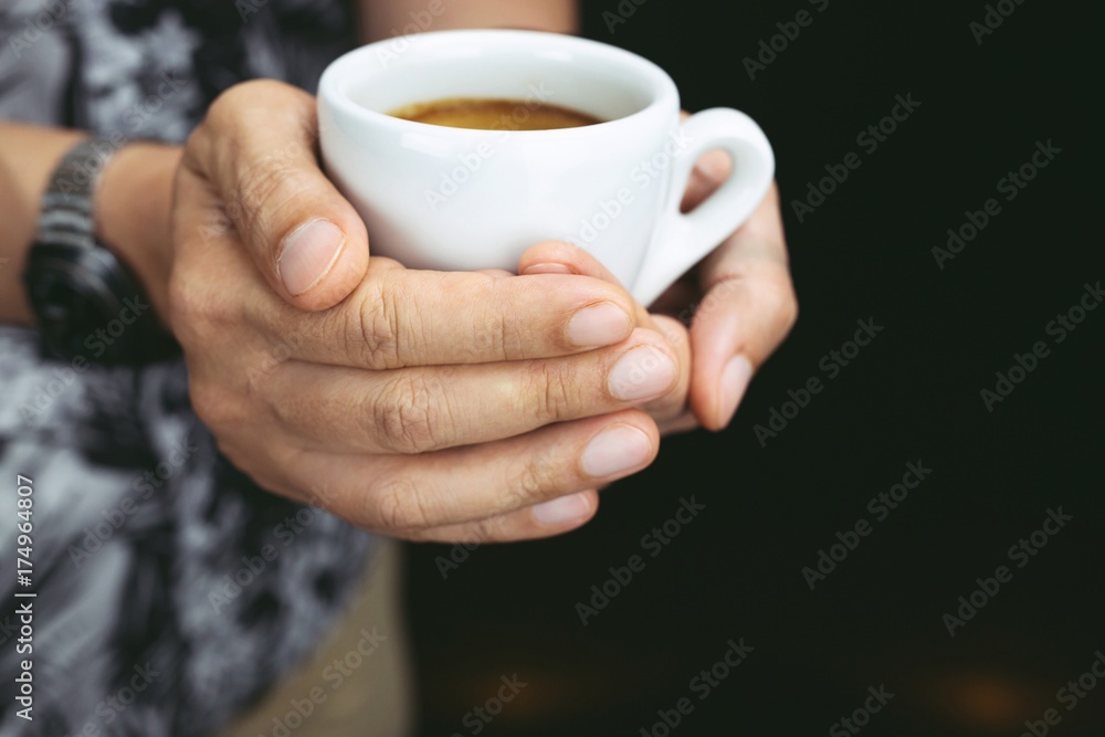 Hands of man holding entwine cup of coffee heart-shaped. Hands of man holding entwine cup of coffee heart-shaped.