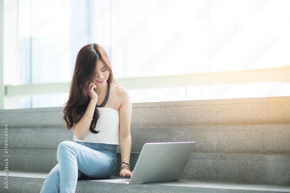 Businesswoman on break. or college student using her computer notebook Businesswoman on break. or college student using her computer notebook