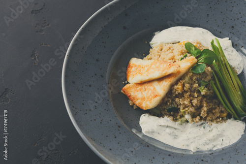 Healthy greek cuisine lunch. Quinoa salad with cheese and vegeta photo