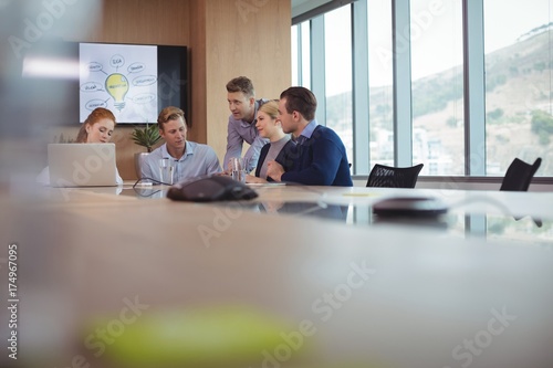 Business people discussing in board room