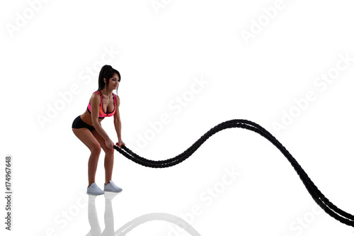 Woman doing crossfit exercise with rope © vital_ml