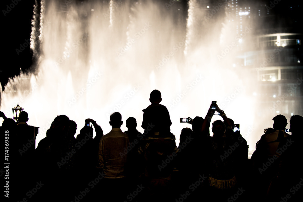 Naklejka premium People recording and enjoying the Dubai fountain show
