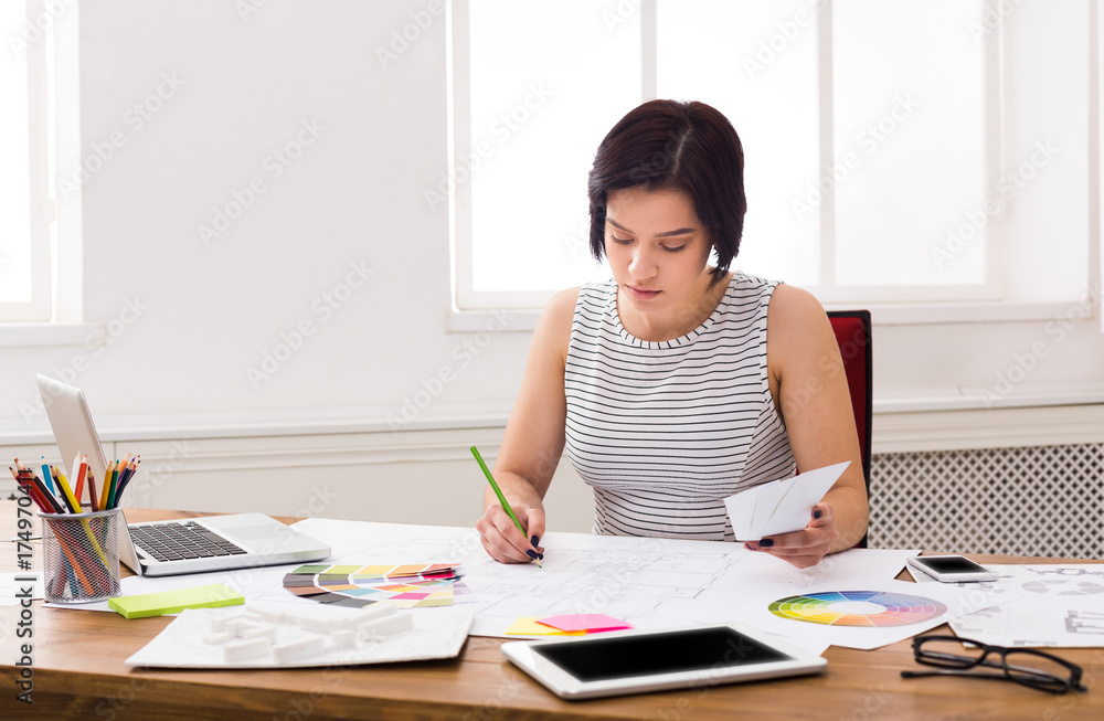 Business woman reading document at office desktop Business woman reading document at office desktop