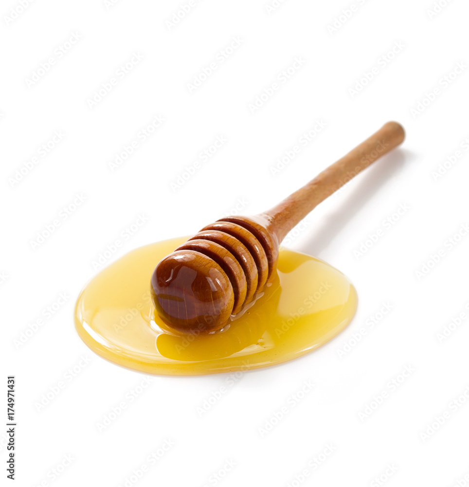 honey and wooden dipper i on white