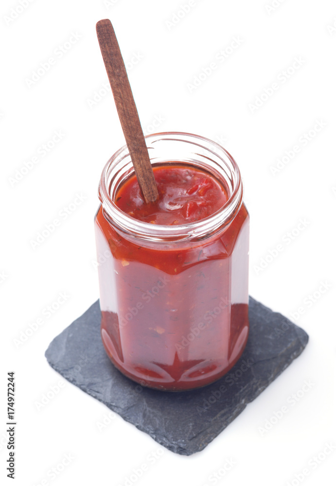 tomato sauce in glass jar on white tomato sauce in glass jar on white