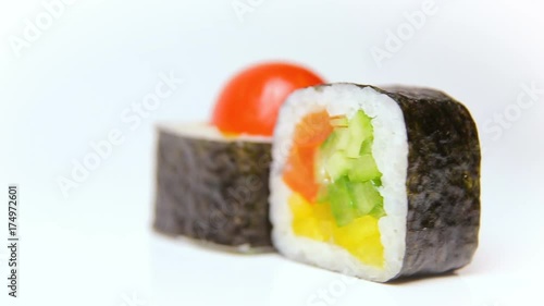 chef presentation of japan restaurant rotation on white Noris Maki sushi rolls with vegetables photo