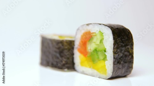 vegan vegetarian sushi rolls ratation on white, isolated