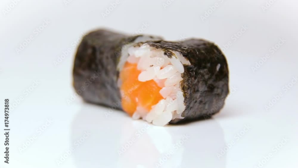 chef presentation of restaurant sushi rolls rotating on white chef presentation of restaurant sushi rolls rotating on white