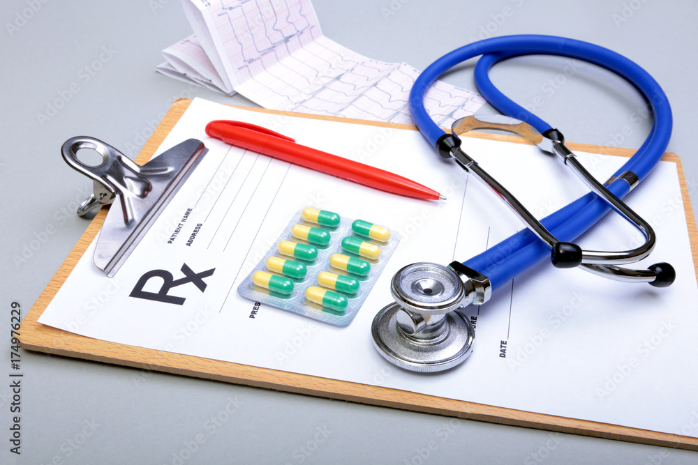 RX prescription, Red heart and a stethoscope isolated on white background RX prescription, Red heart and a stethoscope isolated on white background