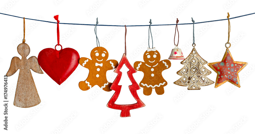 Various Christmas decorations hanging on string isolated on white ...