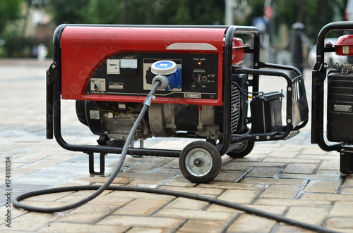 electric generator on city street photo