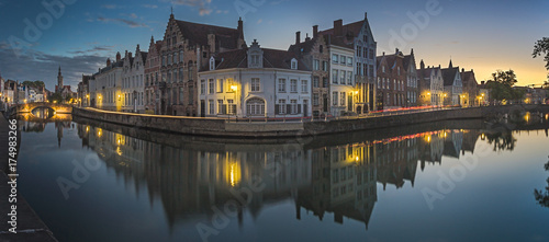 Canals of Bruges with the church of our lady in the background, Bruges, Belgium