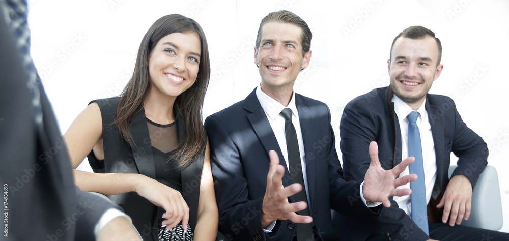 handshake Manager and the client at a meeting in the office lobby. handshake Manager and the client at a meeting in the office lobby.