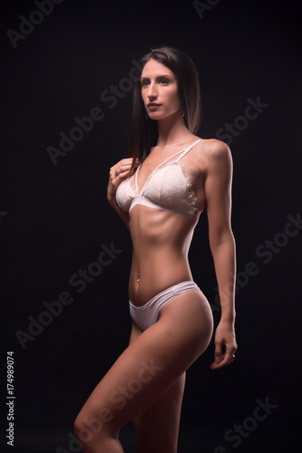 one young adult woman, standing model posing, black hair, white lingerie, white bra, white undergarment, © HD92