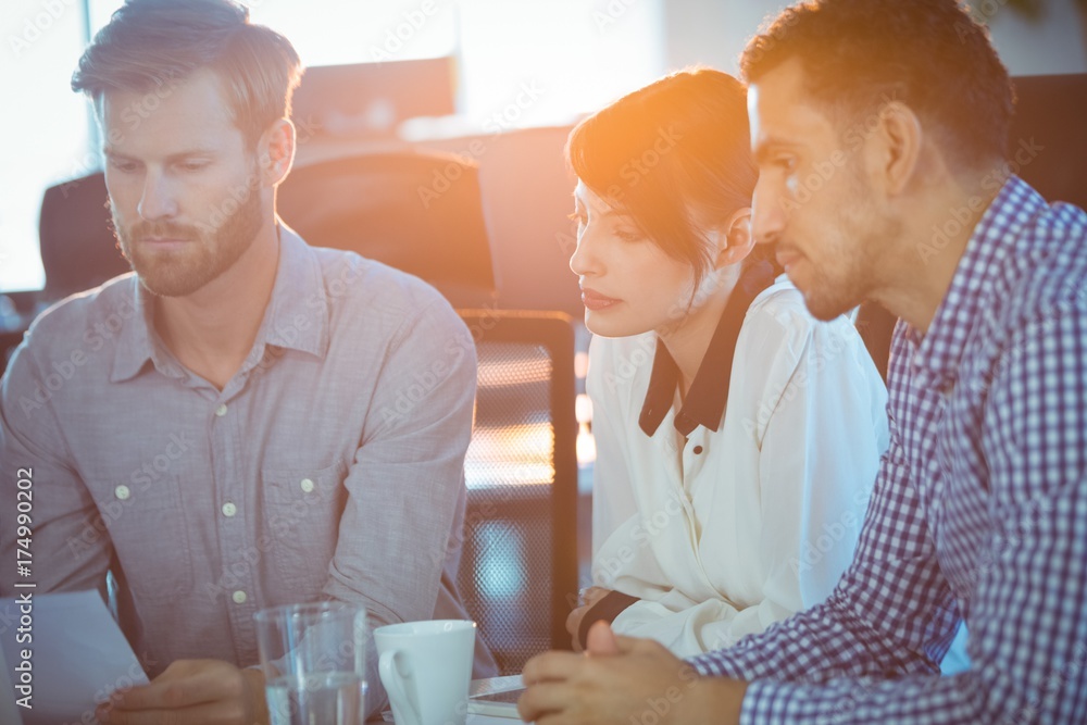 Focused business partners sitting in meeting Focused business partners sitting in meeting