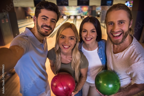 Friends playing bowling