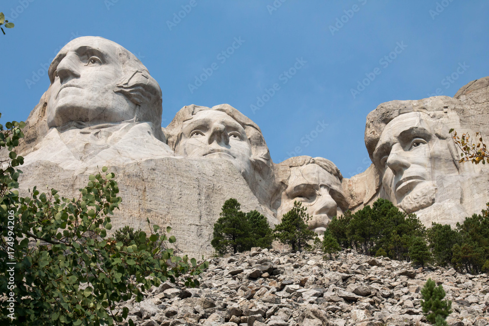 Mount Rushmore, carved faces of presidents over stones